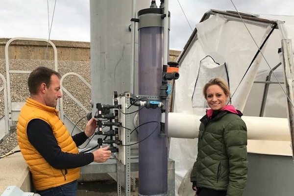 WEL Enterprise CEO Katrina Eckard with her water reclamation system. WEL is a member of Pipeline's first class. 