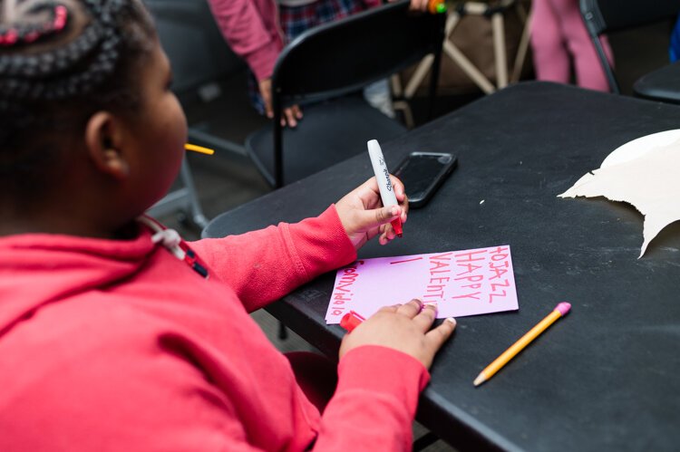 Making Valentine's Day cards after school at Seven Hills Neighborhood Houses, West End.