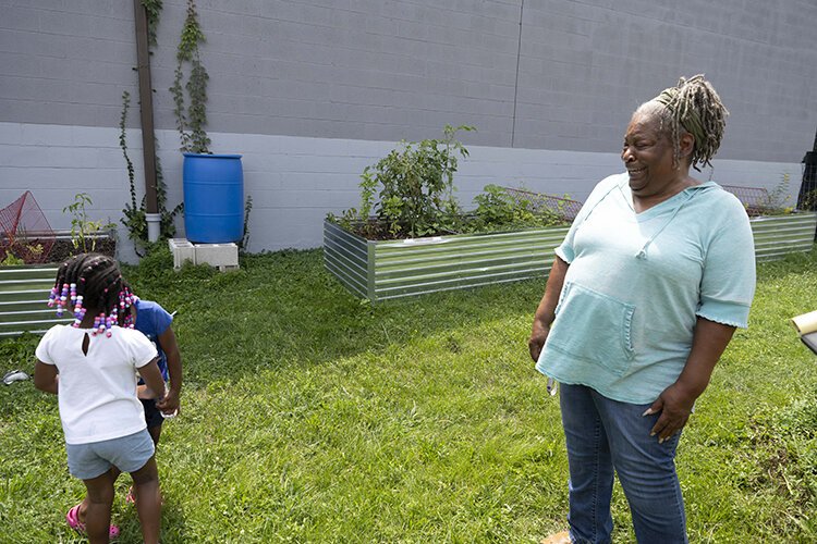 Theresa Thomas oversees the community garden next to her church in South Fairmount.