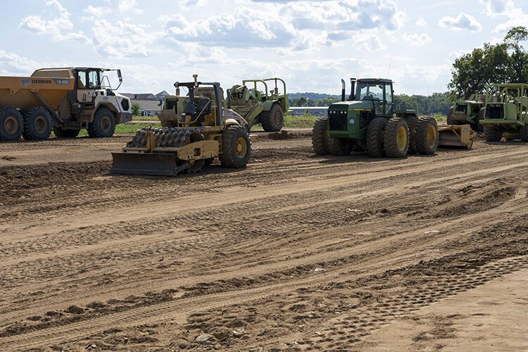 Clearing and leveling the land for new housing.