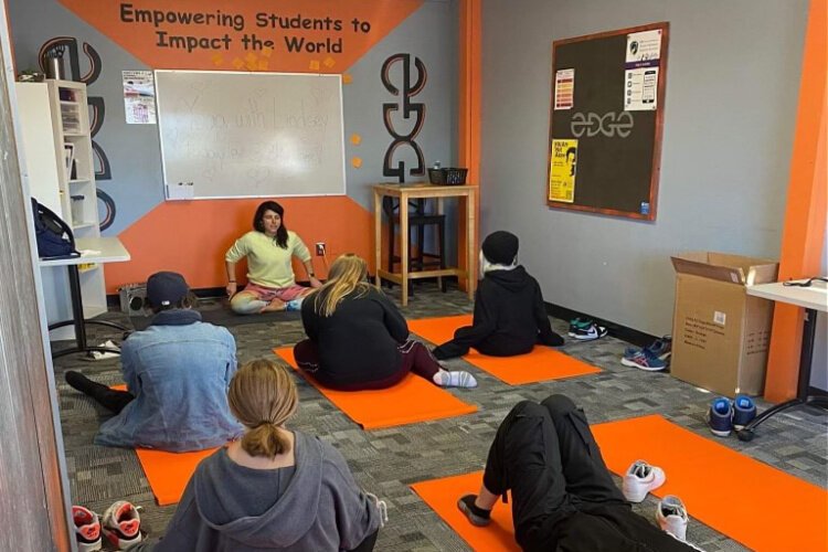 Health and life coach Lindsey Bonadonna teaches yoga at the EDGE Center.