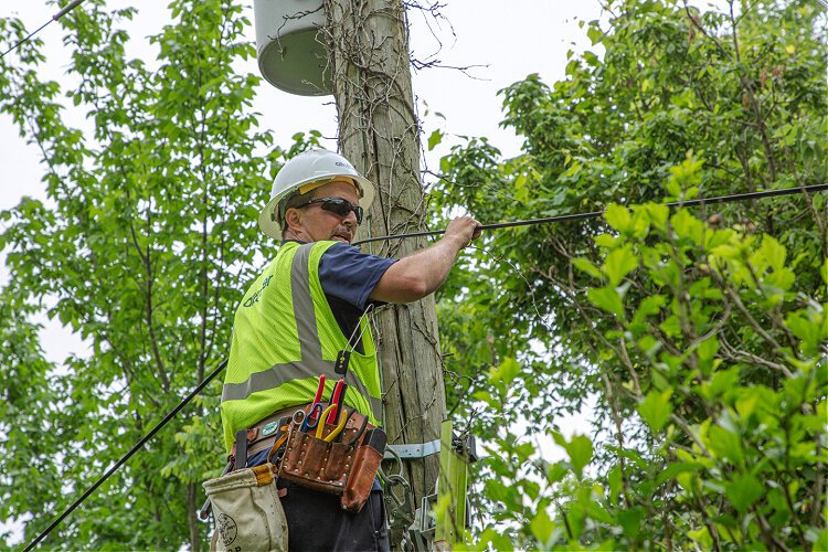 An Altafiber technician installs high speed fiber optic lines in Kentucky. 