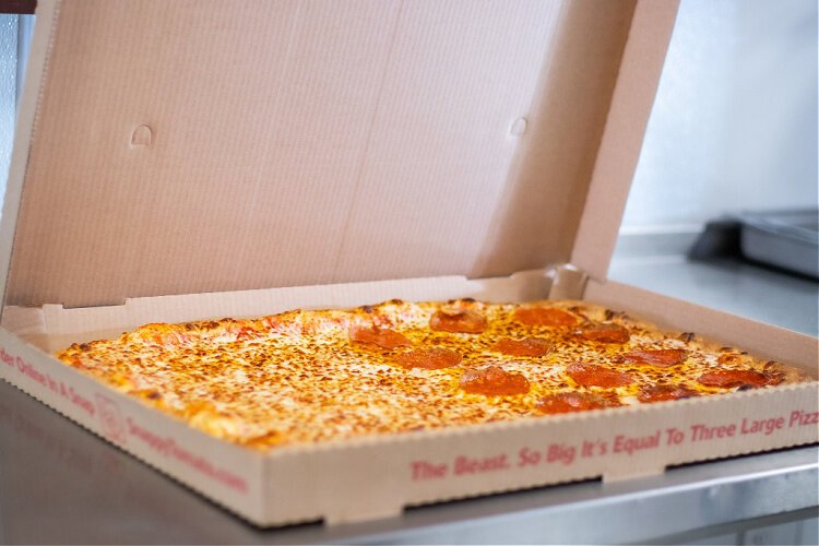 The Beast pizza can feed 8 to 10 adults, Snappy Tomato says.