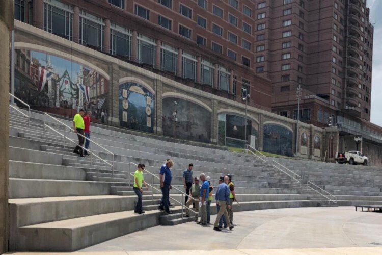 People from City Hall and the construction team do a walk-through of Covington Plaza.