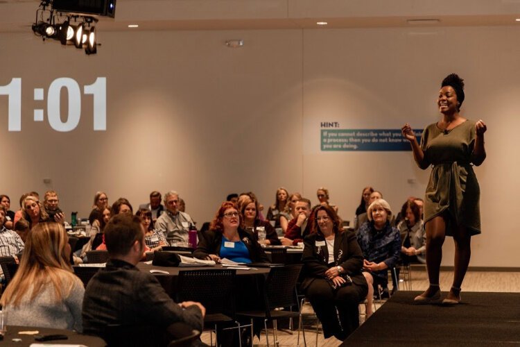 Working against the clock, Ernaisja Curry of Pones, Inc. presents her pitch to the audience of nearly 300.