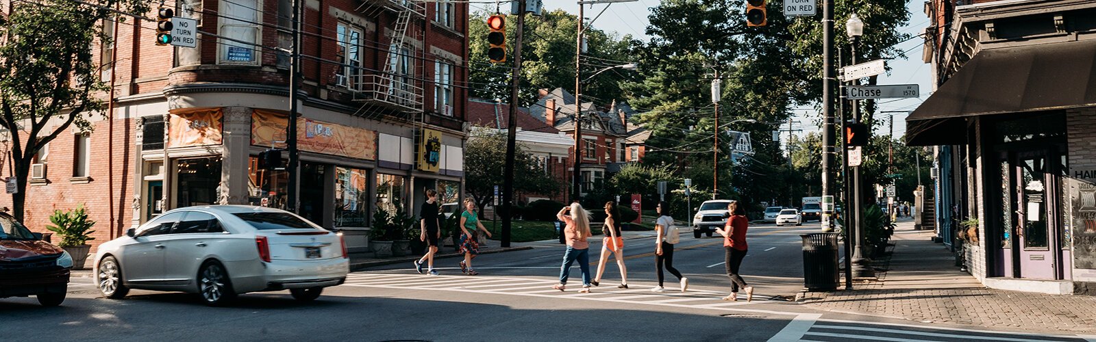 Northside residents march the crosswalks in the community's business district. 