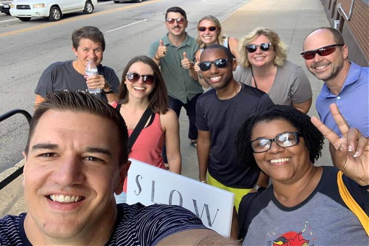 College Hill neighbors have gathered four times to march the business district crosswalks.