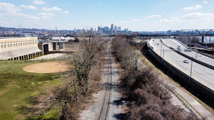 Lower Price Hill's environmental legacy: a sewage treatment plant, rail line, and a highway.