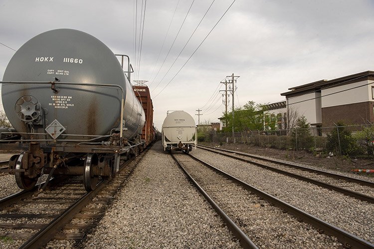 Trains with tanker cars pass by populated communities every day, 